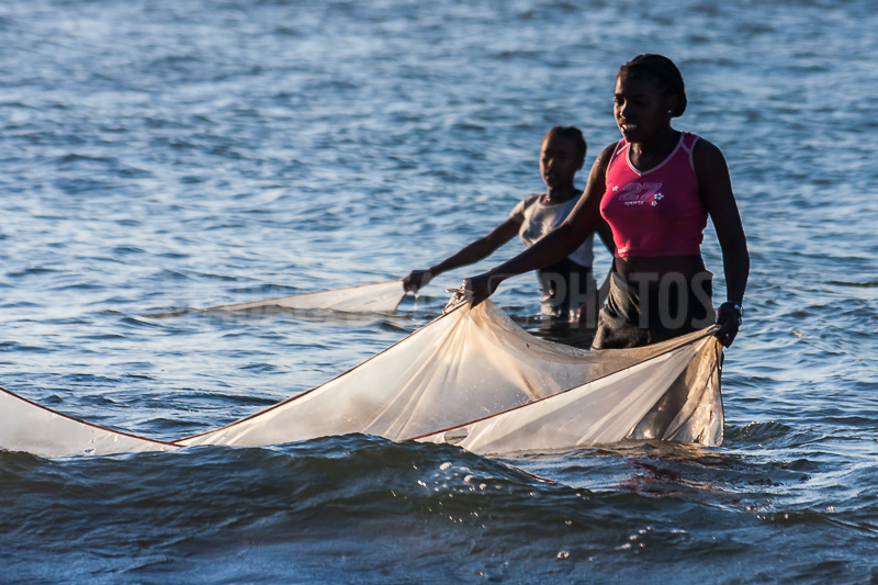 Women fishing bichiques in Antalaha