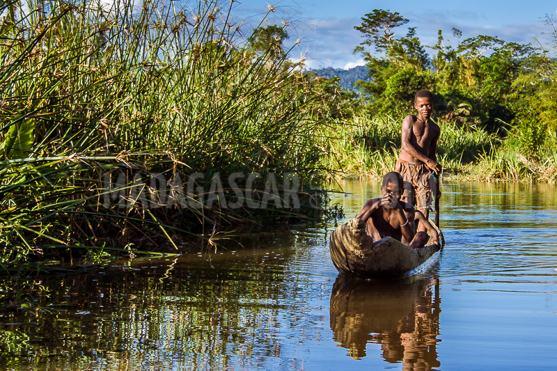 Young boatmen in the canals of Maroantsetra, Madagascar